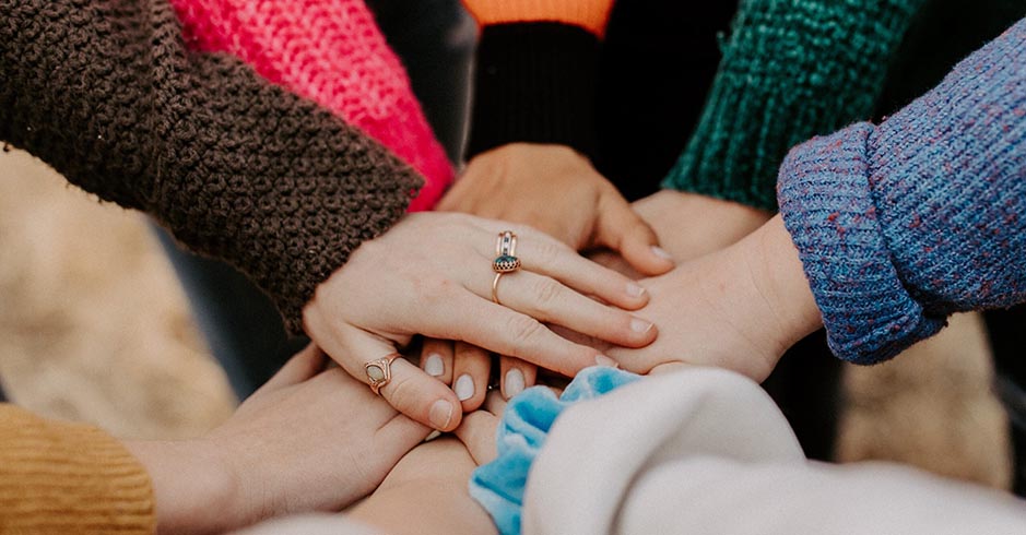 Photo by Hannah Busing on Unsplash. Joined Hands