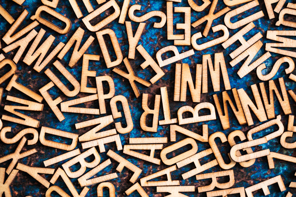 wooden letters scattered over a surface.