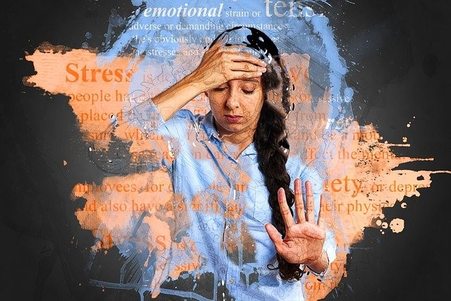 Image highlighting a stressed individual with lots of thoughts going round her head. 