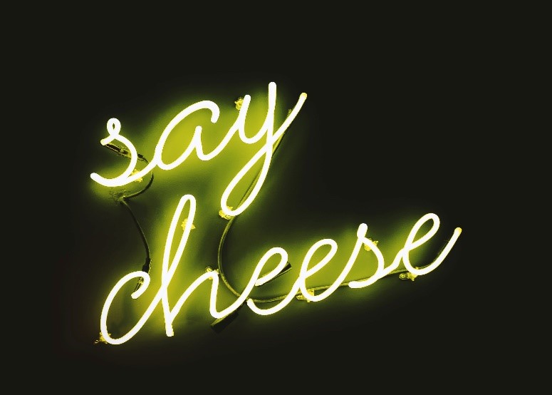Neon lights saying 'say cheese'