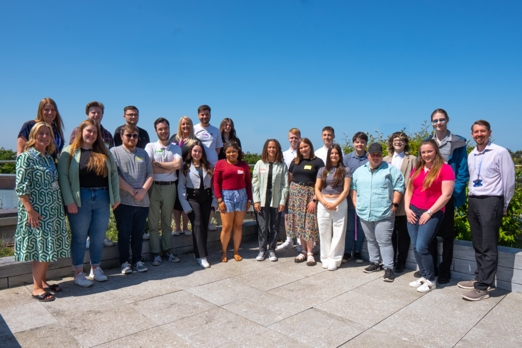 Group photo of 2023 student digital interns on the Catalyst rooftop with LTD staff