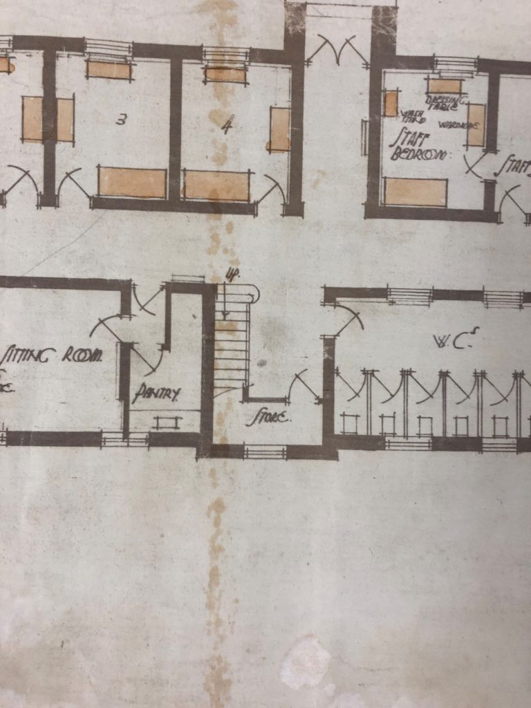 This plan of the University’s main building is mostly black and white with some colour in the form of brown rectangles to signify furniture. The focus of this plan is the word ‘store’ in the stairwell location, with pantry and then sitting room to the left, and WC to the right.