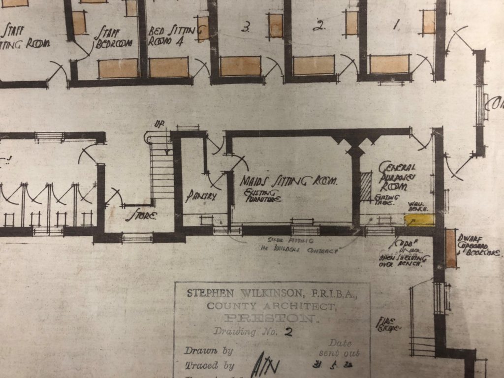 This plan of the University’s main building is mostly black and white with some colour in the form of brown and one yellow rectangles to signify furniture. In the middle of this plan is the maids’ sitting room, with the pantry to the left, then store in the stairwell. To the right of the maids’ sitting room is the general purposes room. 