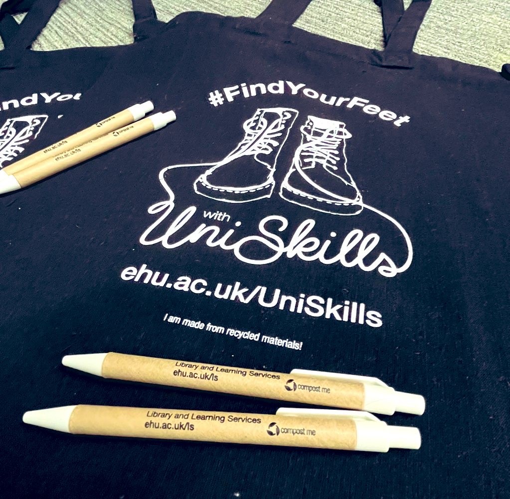 Black UniSkills book bags with compostable pens on top.