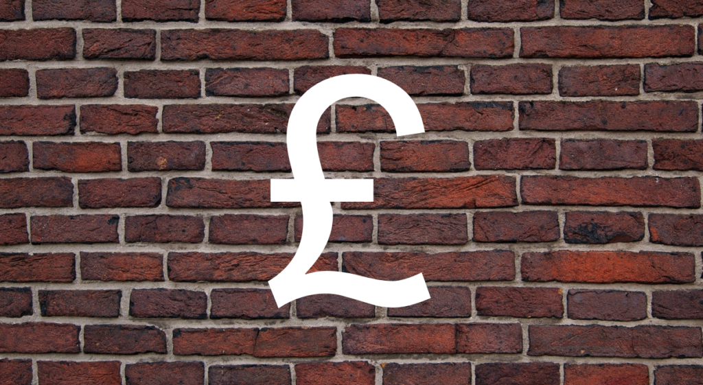 an image of a brick wall with a Great British pound symbol. This represents a paywall