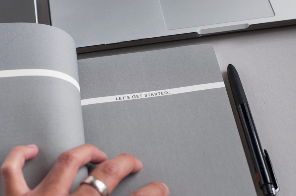 image of a notebook that says let's get started