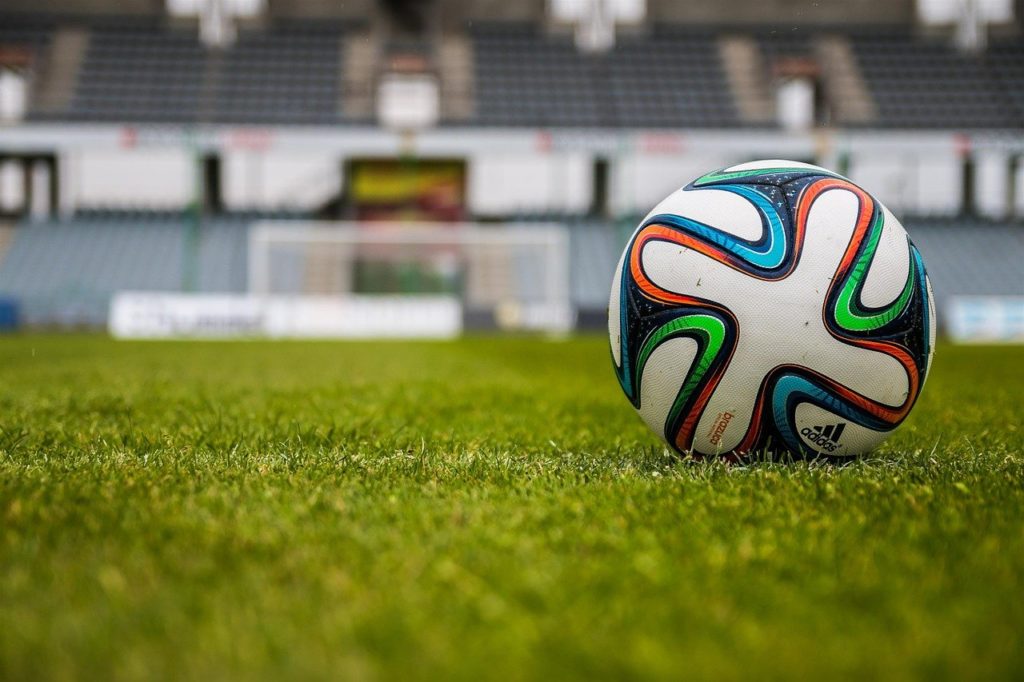 a football on the field in a stadium
