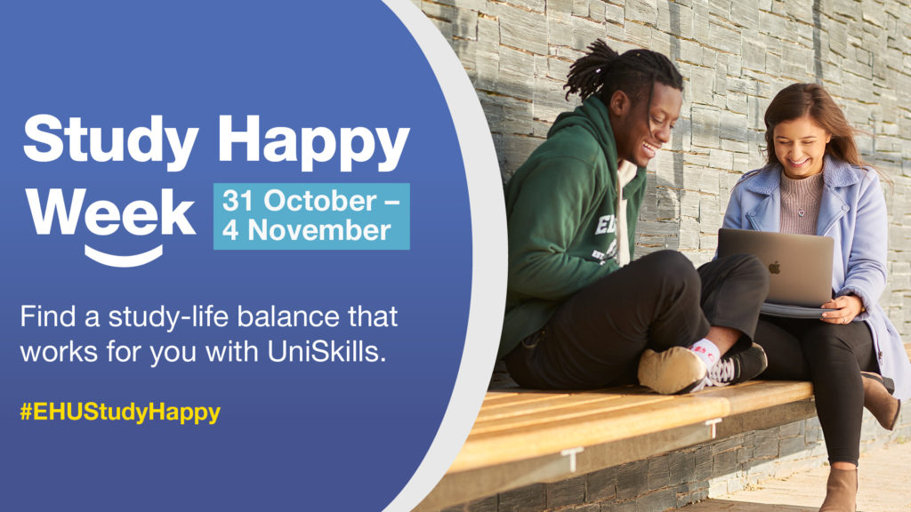 Two students sat on a bench smiling