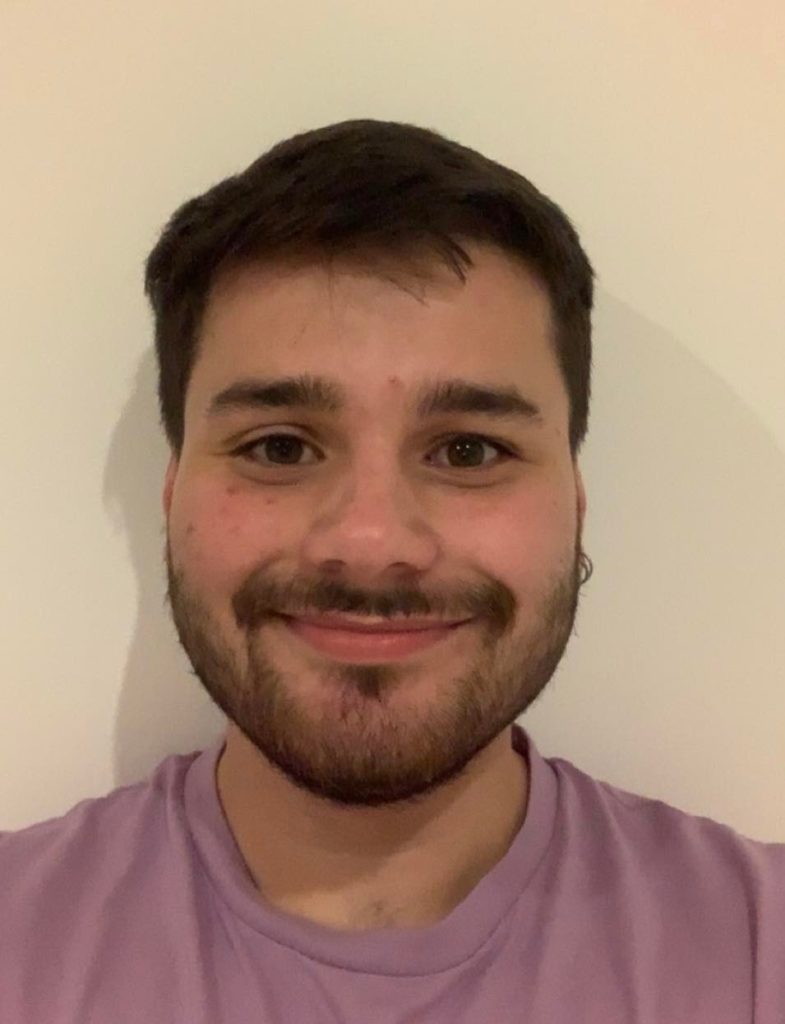 Tom smiling at the camera