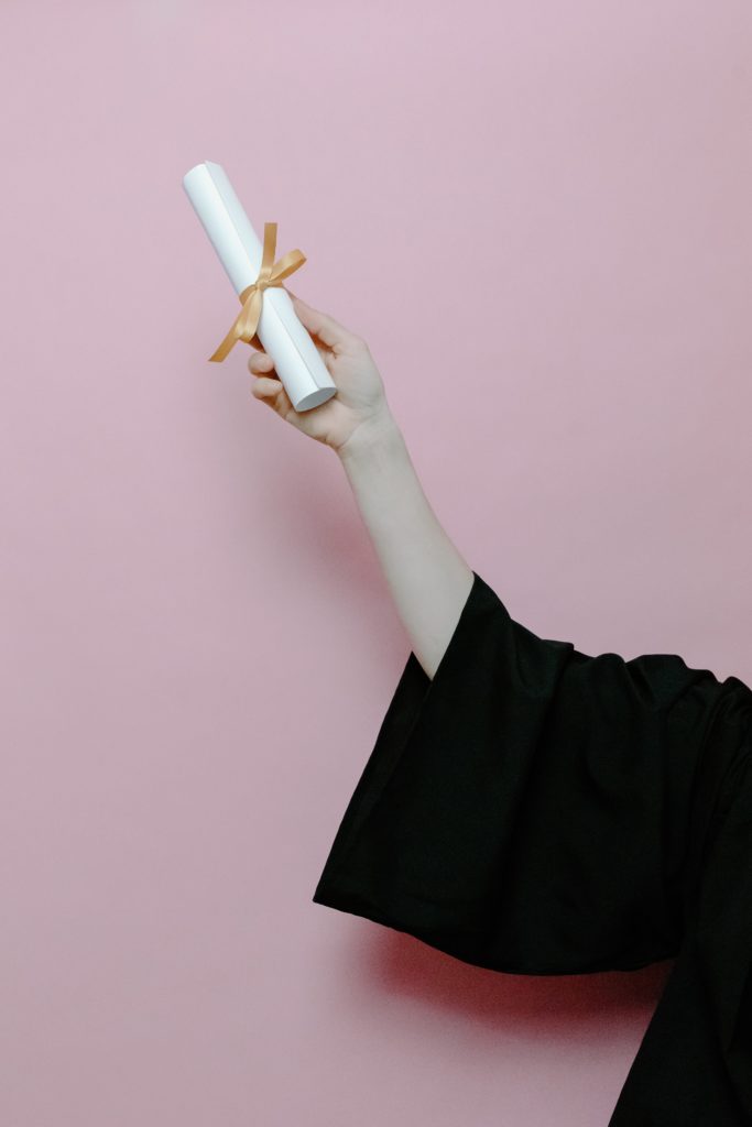 graduate holding a certificate
