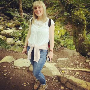 Photograph of Claire Olson, on a walk in the countryside.